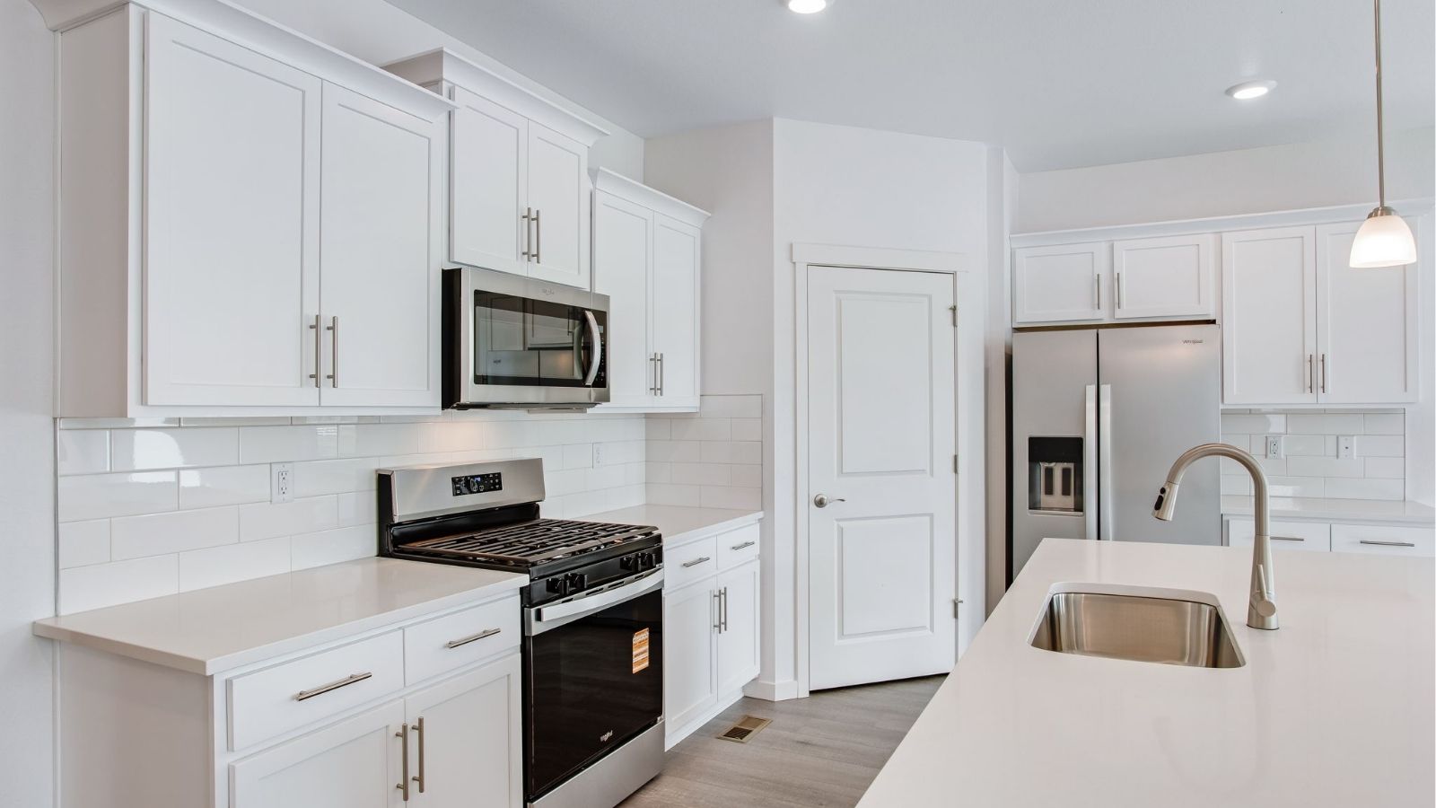 White kitchen cabinets in new D.R. Horton home
