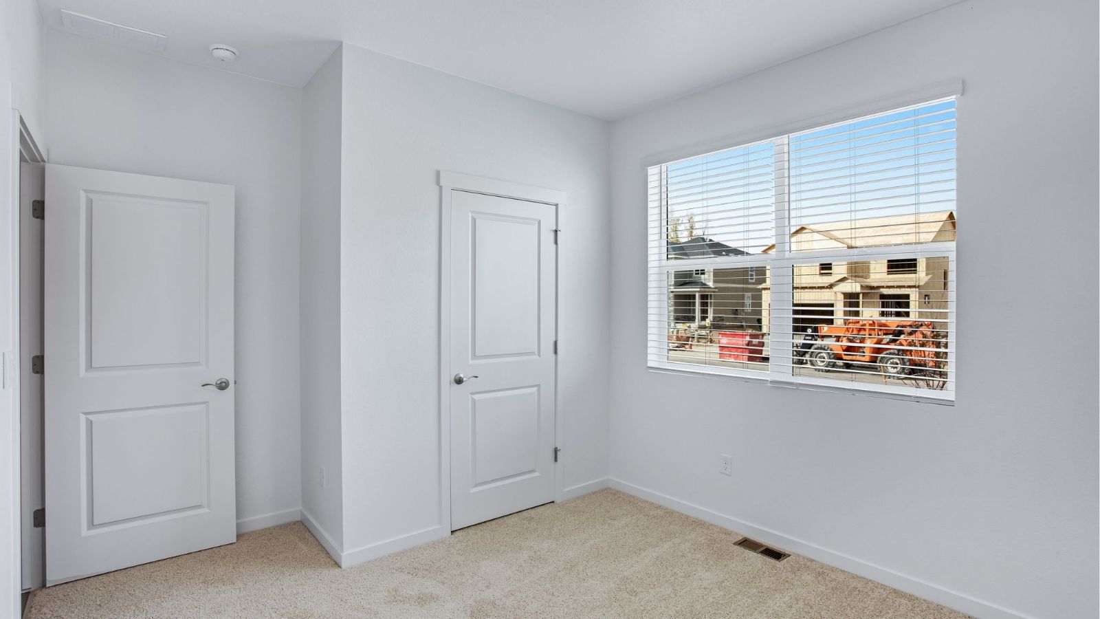 Bright guest bedroom in the Newcastle home featuring generous space and modern finishes.
