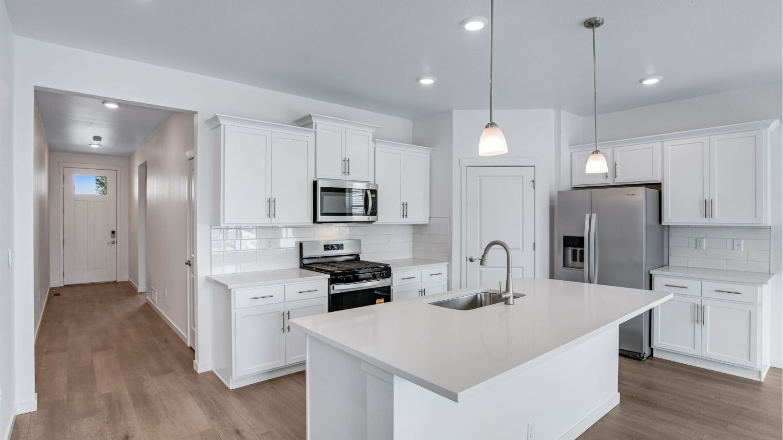 Modern Newcastle kitchen featuring quartz countertops, stainless steel appliances, and an oversized island.