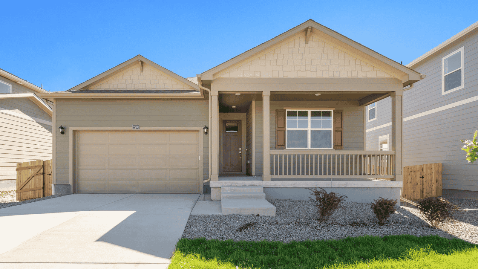 Exterior of the Newcastle floor plan at Westgate featuring attractive curb appeal and a two-car garage.
