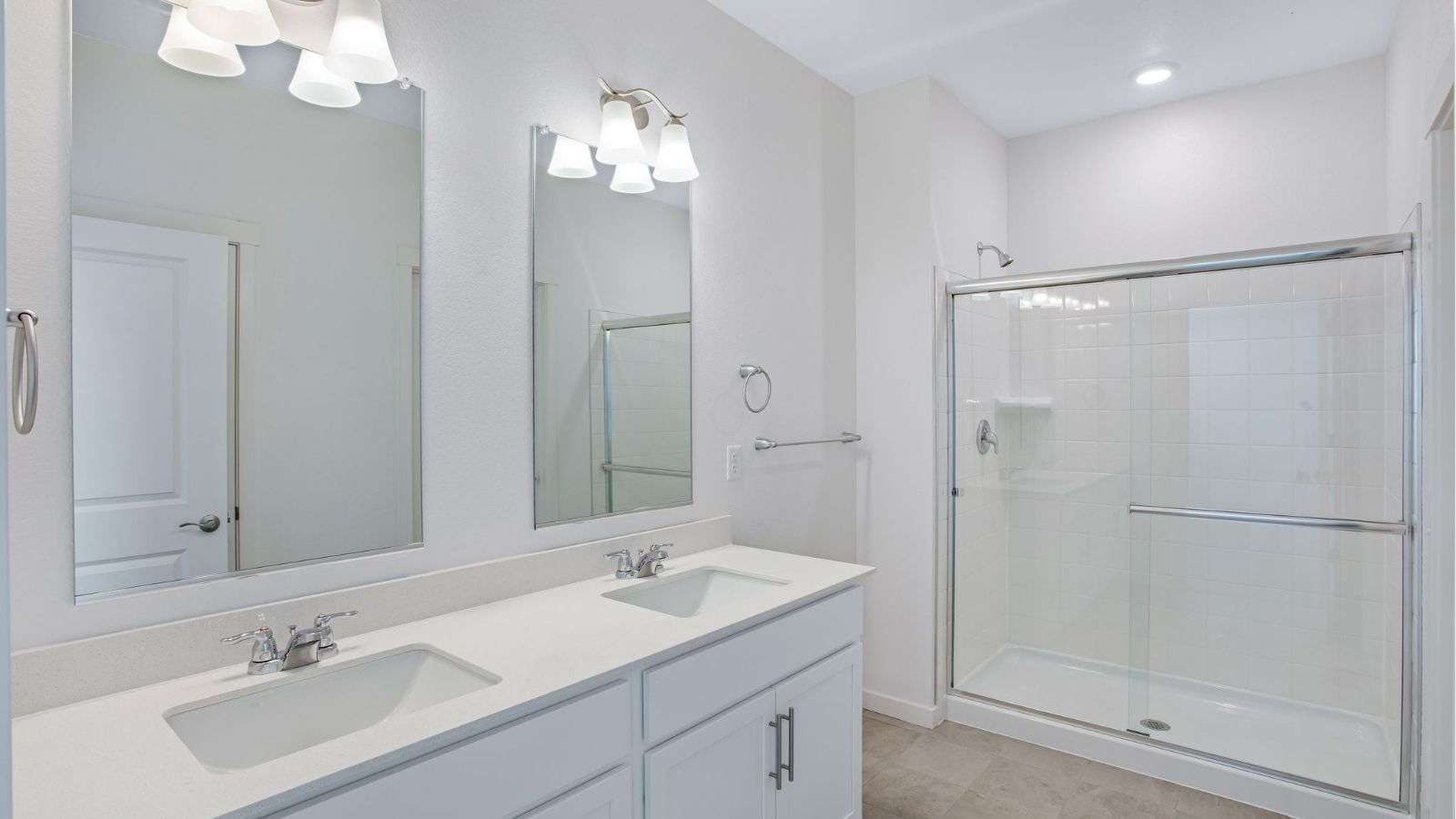 Modern primary bathroom in the Newcastle home featuring stylish finishes and convenient storage.