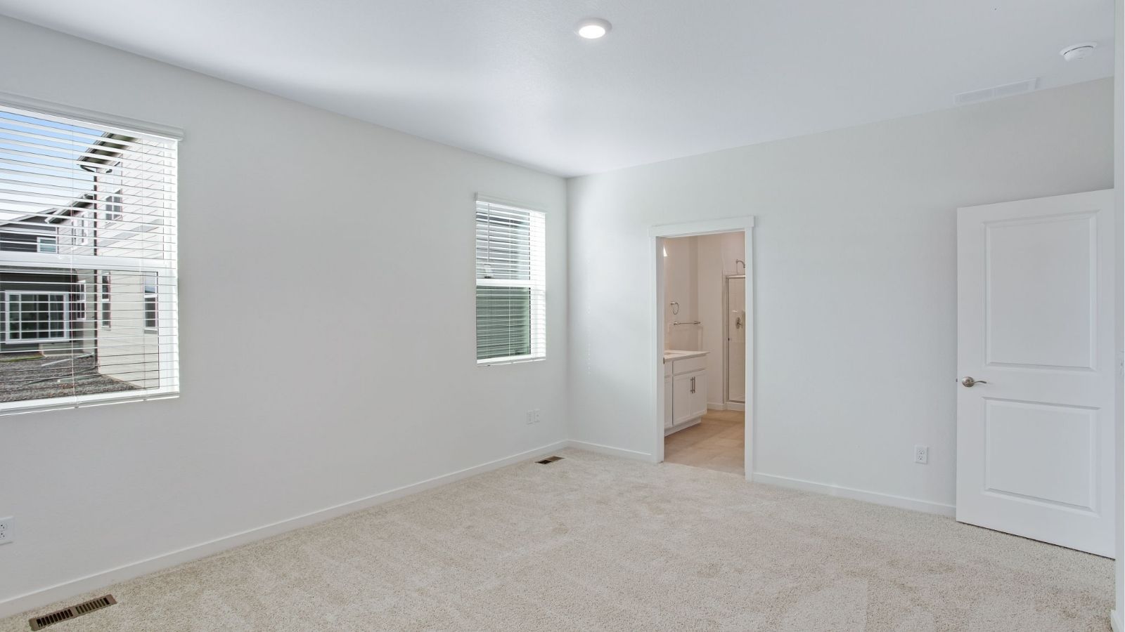 Private primary suite in the Newcastle floor plan featuring a spacious layout and walk-in closet.