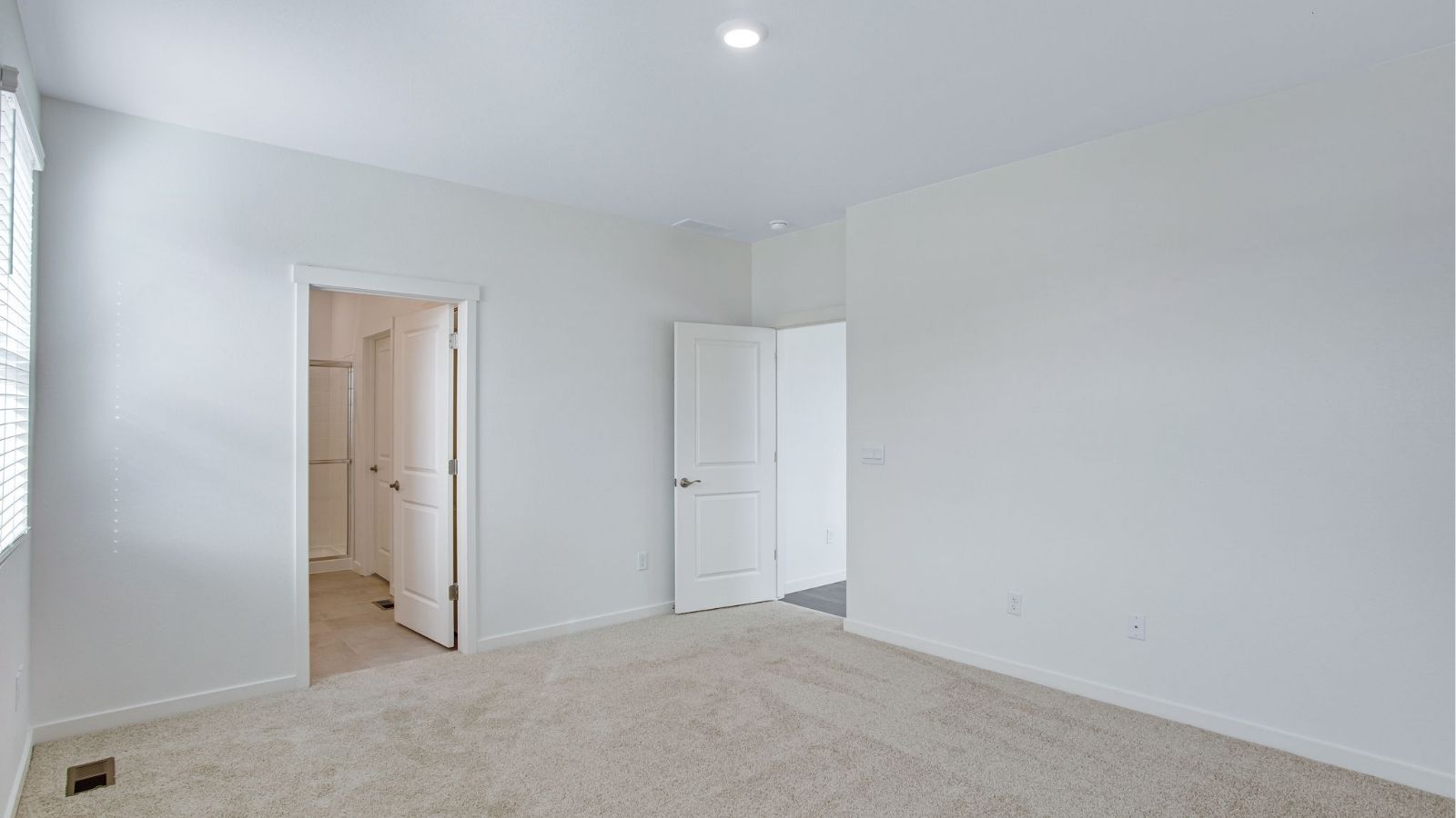 Spacious bedroom in the Newcastle floor plan designed for comfort and flexibility.