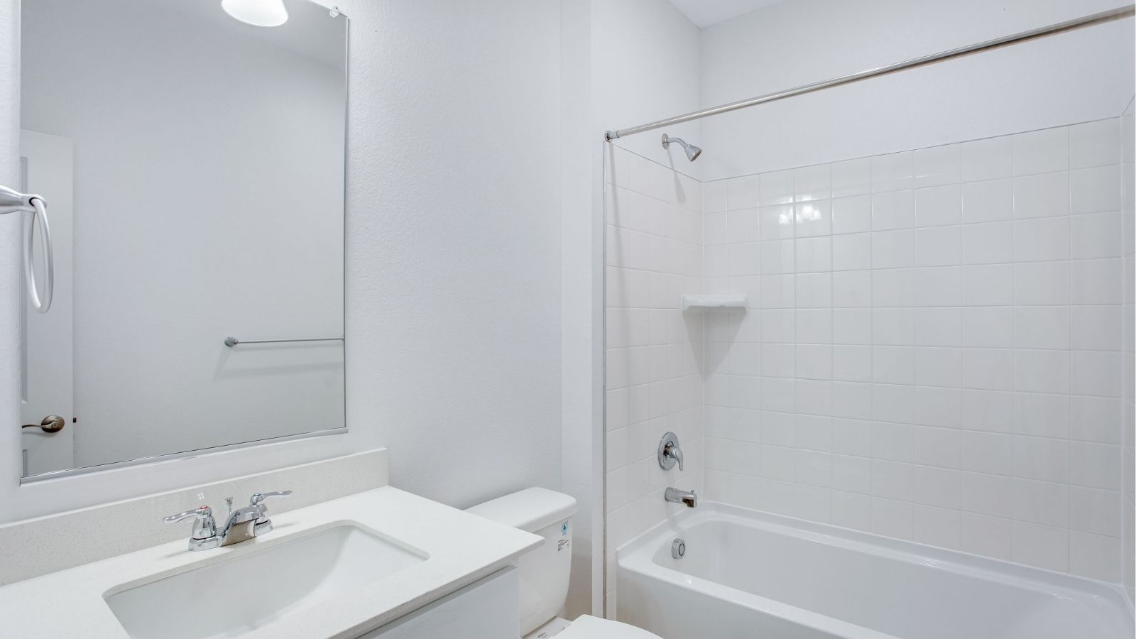 Full bathroom in the Newcastle home featuring modern fixtures and clean, contemporary design.
