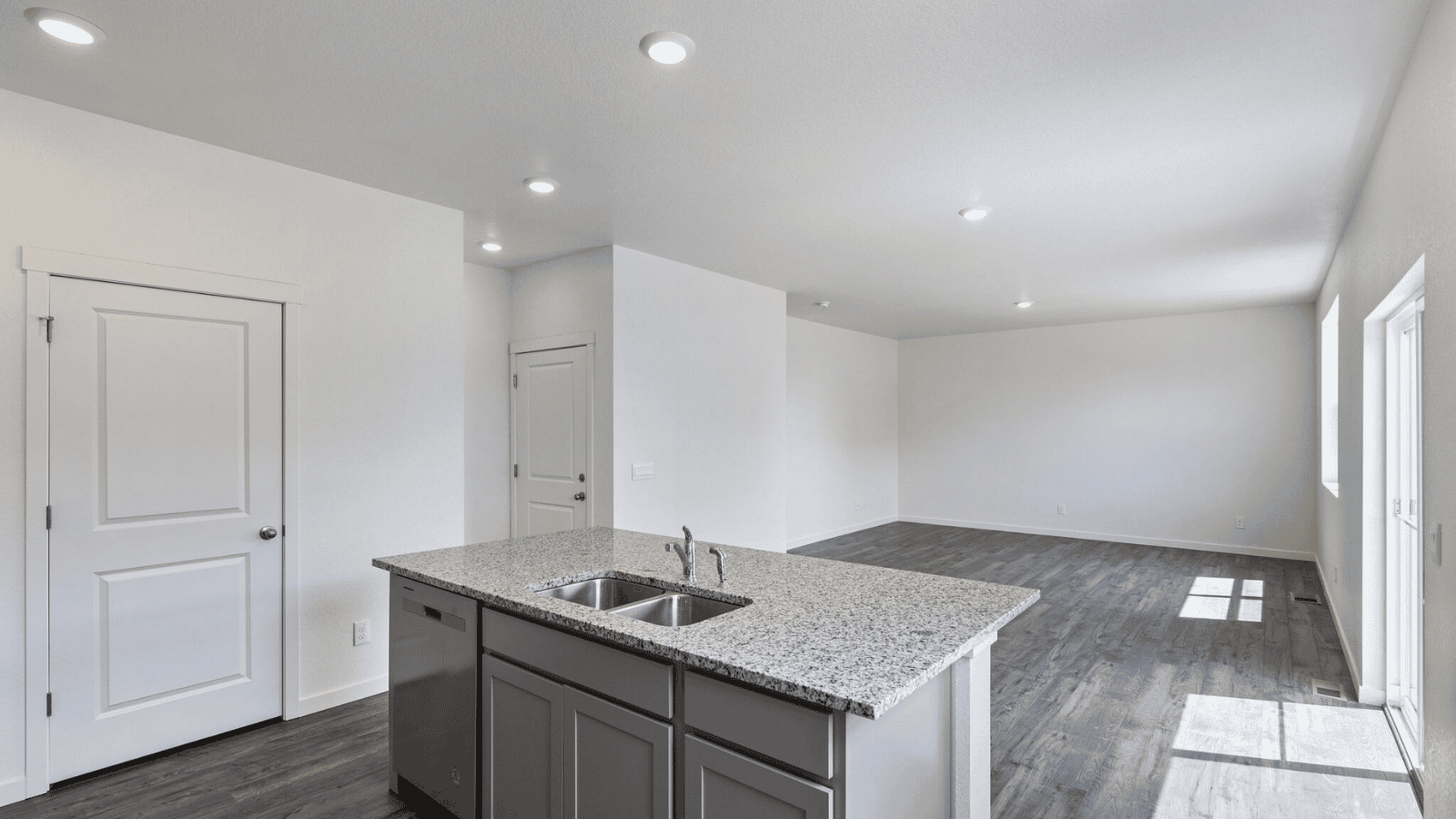 Spacious living area in the Sienna home connected to the kitchen and dining space for effortless entertaining.