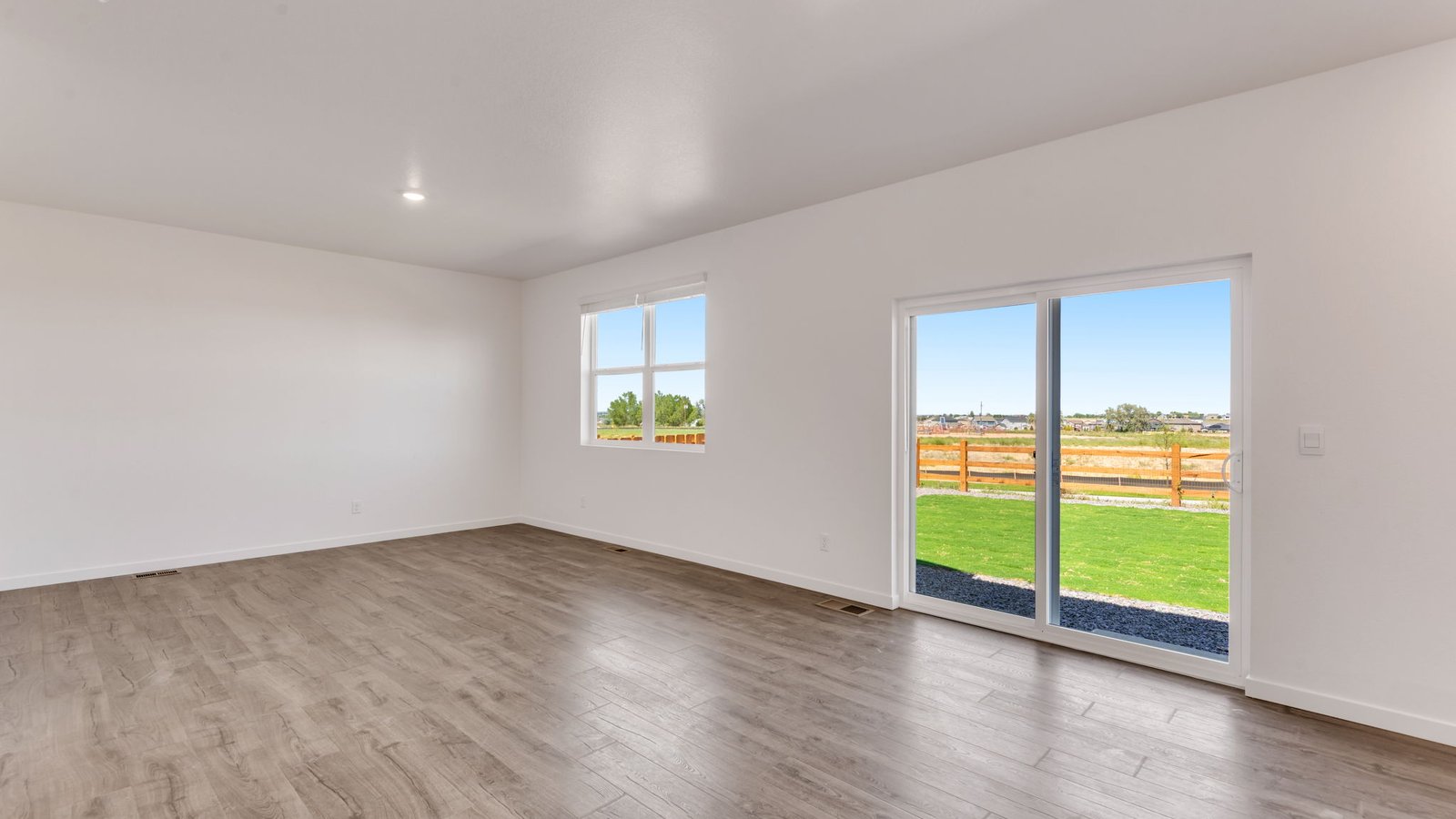 Dining nook adjacent to the kitchen with backyard access and abundant natural light.