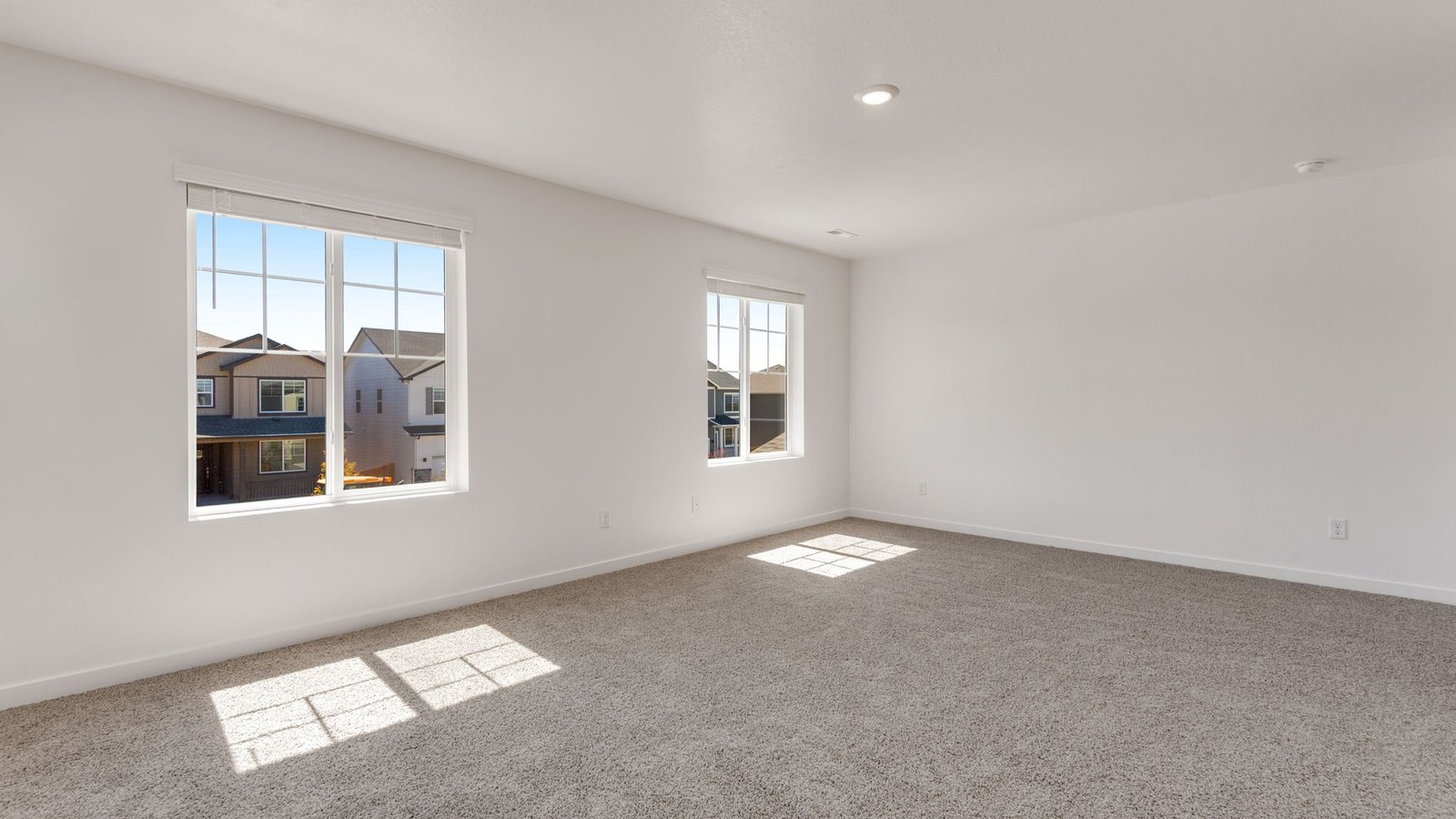 Private primary bedroom with generous layout and abundant natural light.