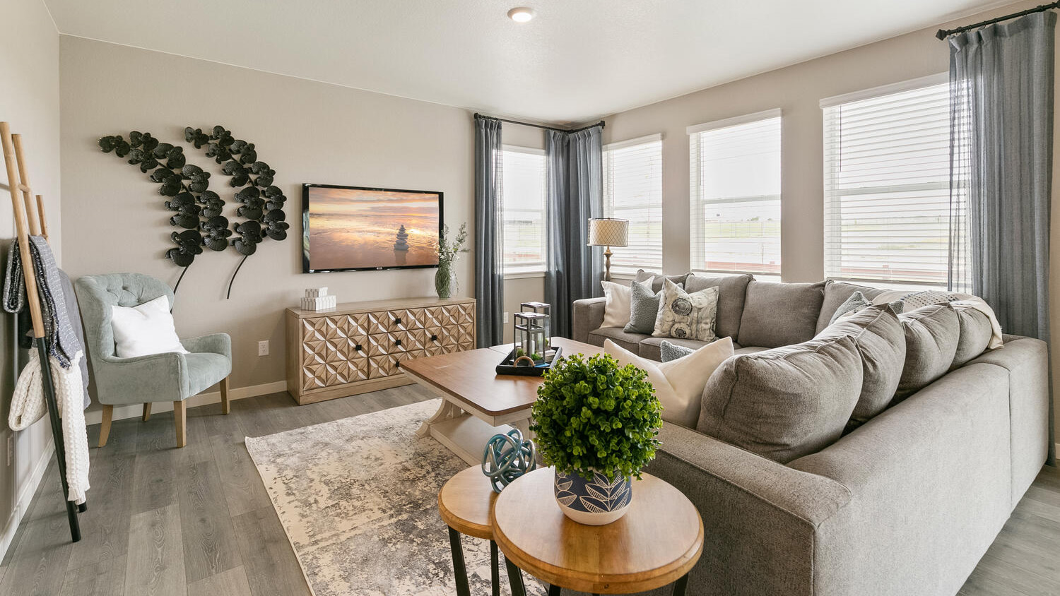Open living area with modern finishes, 9-foot ceilings, and seamless flow to the dining area and kitchen.