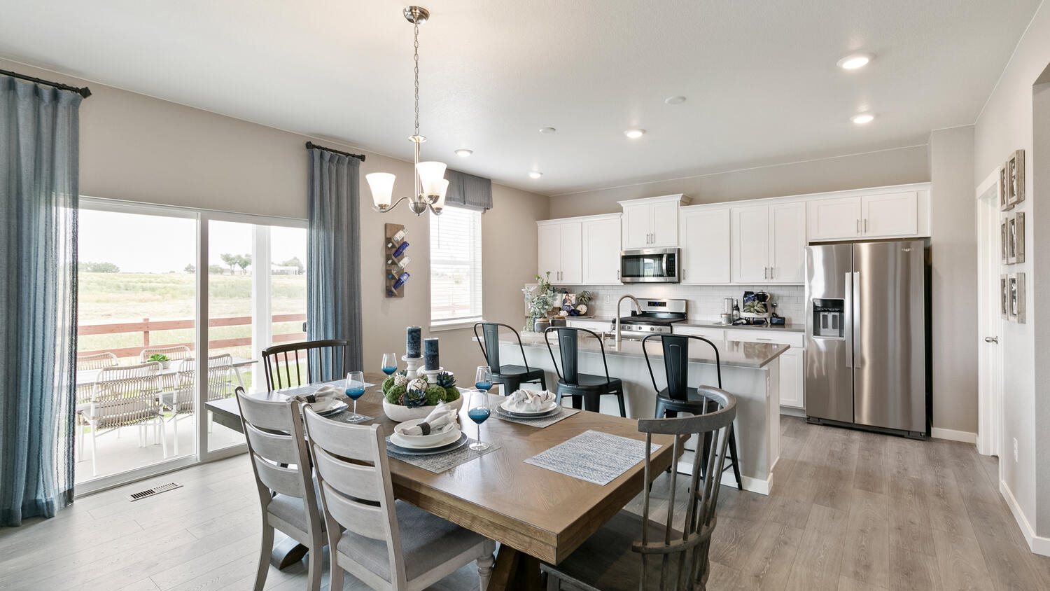 Bright and inviting great room designed for everyday living and entertaining, with views overlooking the backyard.