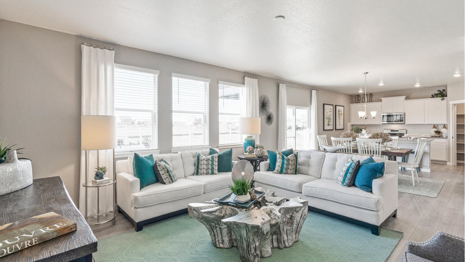 Living room with large windows in new D.R. Horton Westgate home in Greeley, CO