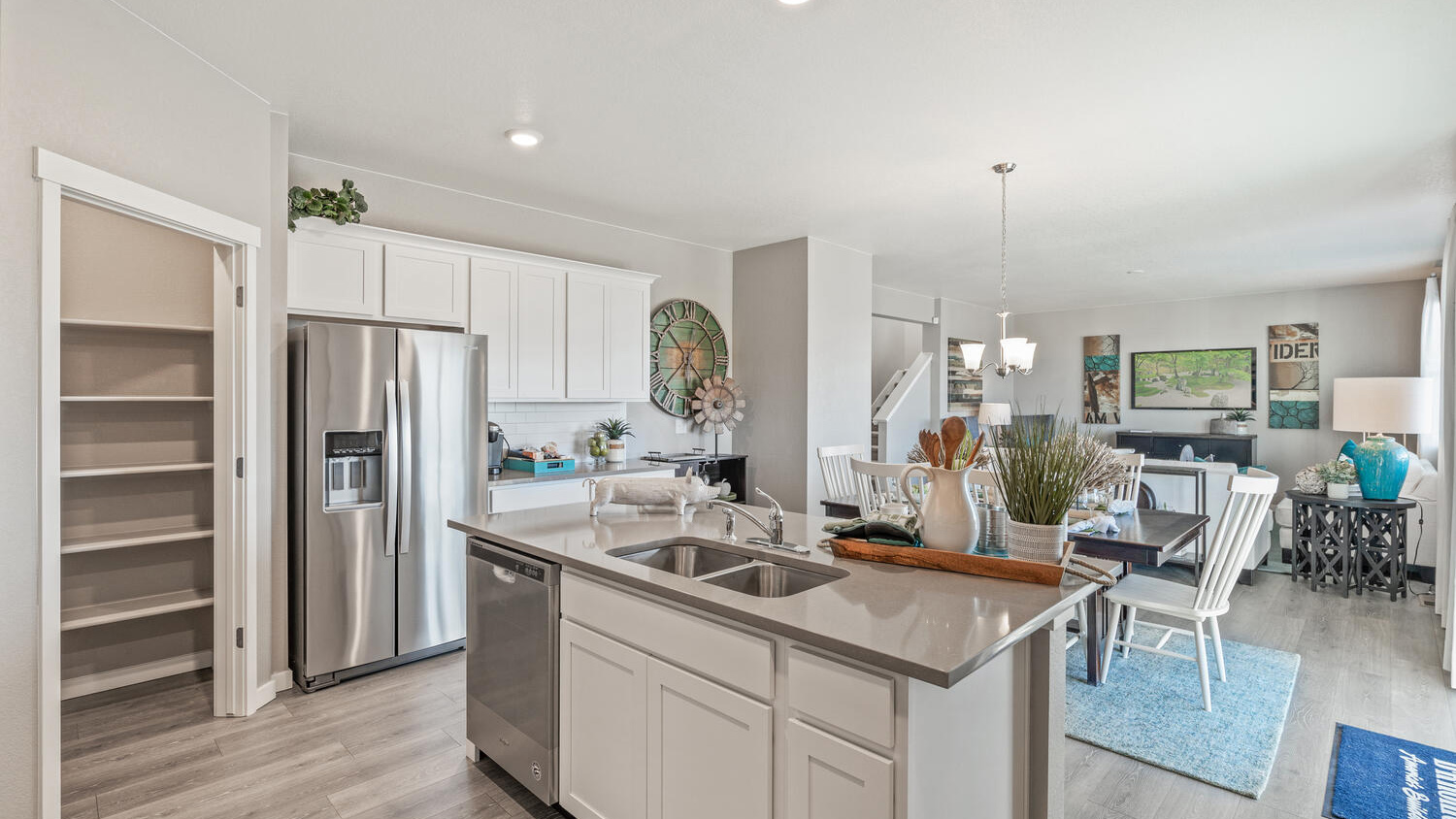 Kitchen with large walk-in pantry in Hennessy floorplan in new D.R. Horton Westgate community Greeley, CO