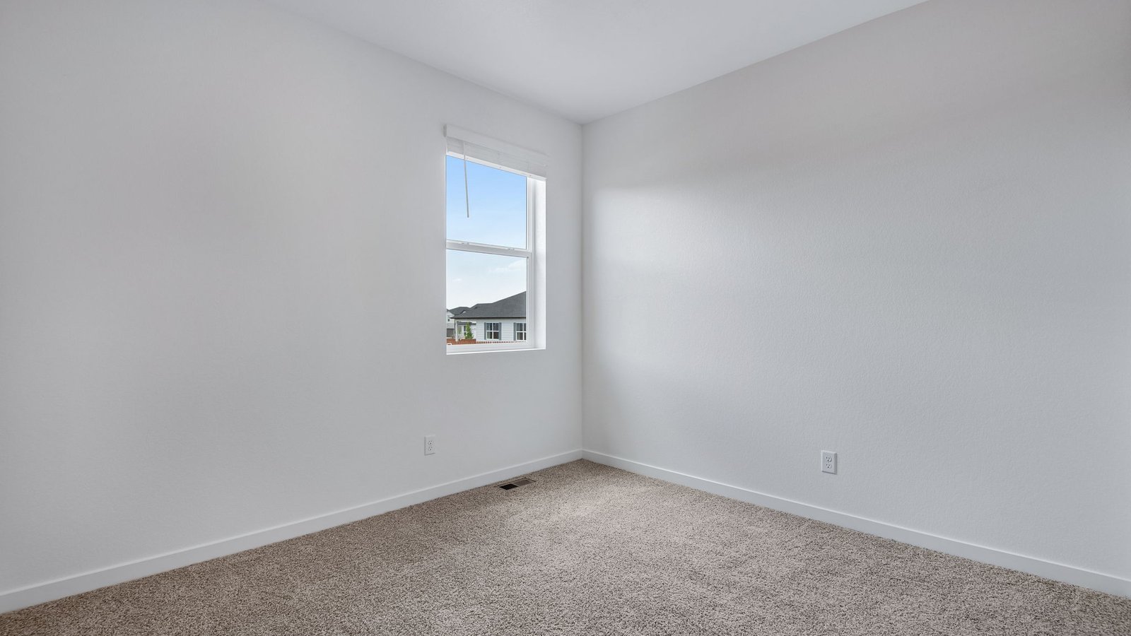 bedroom with window in new construction home fort lupton, co