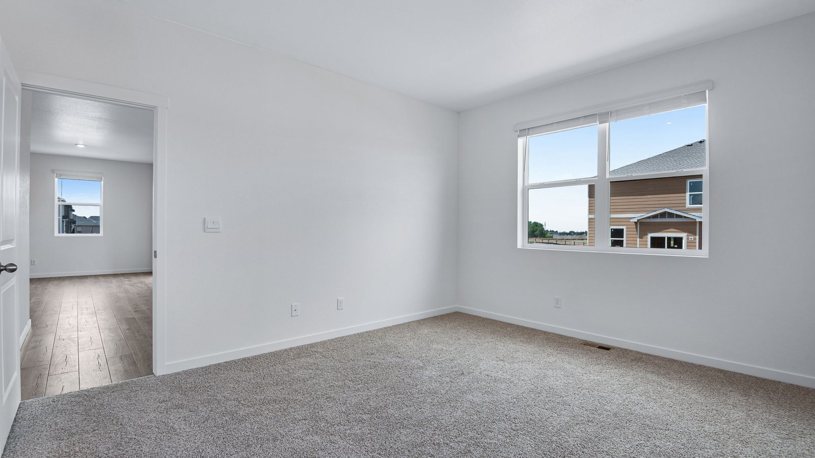 primary bedroom with ensuite in new construction home by d.r. horton