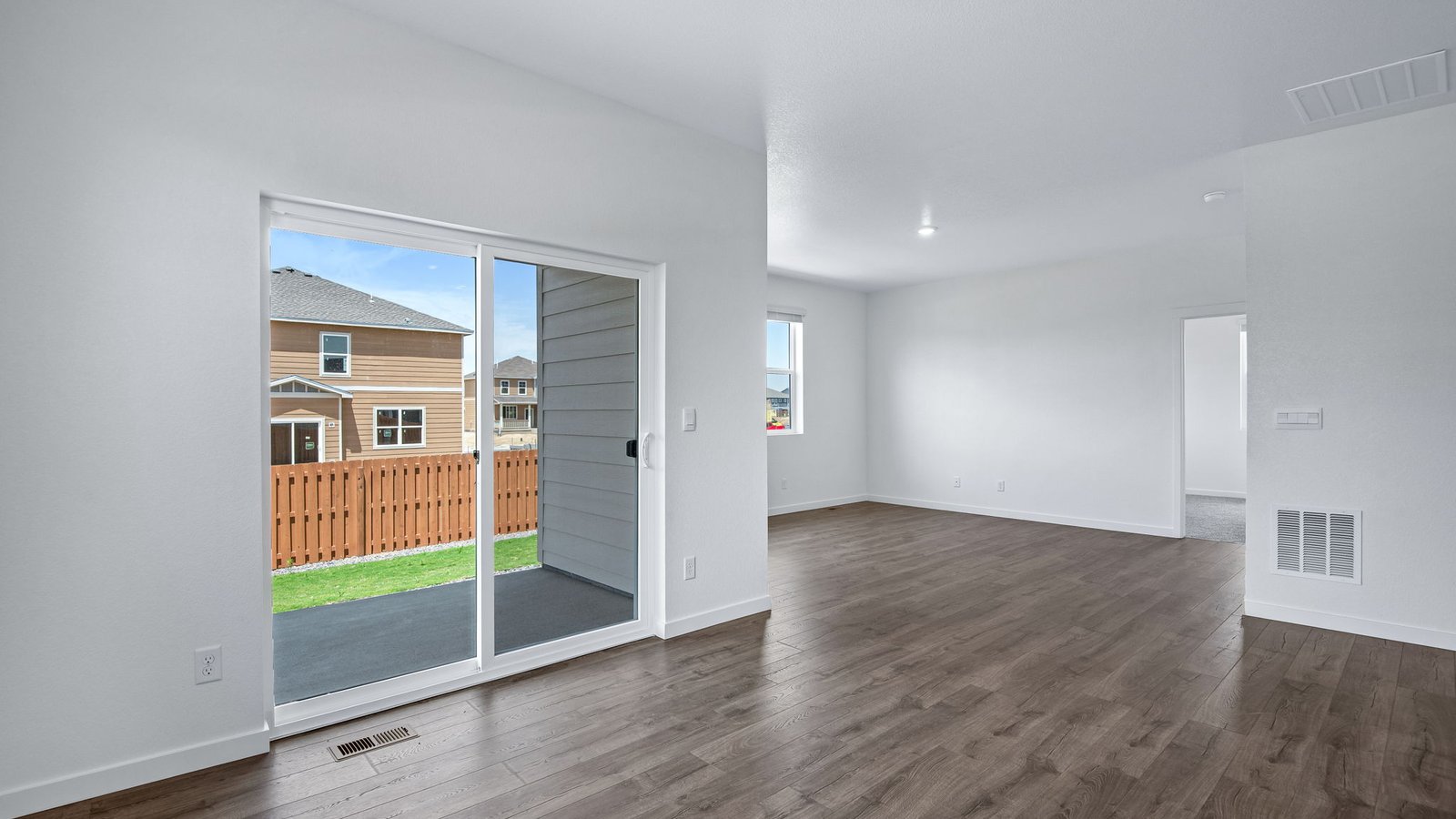 Open concept floor plan with large windows and access to backyard in Chatham floor plan