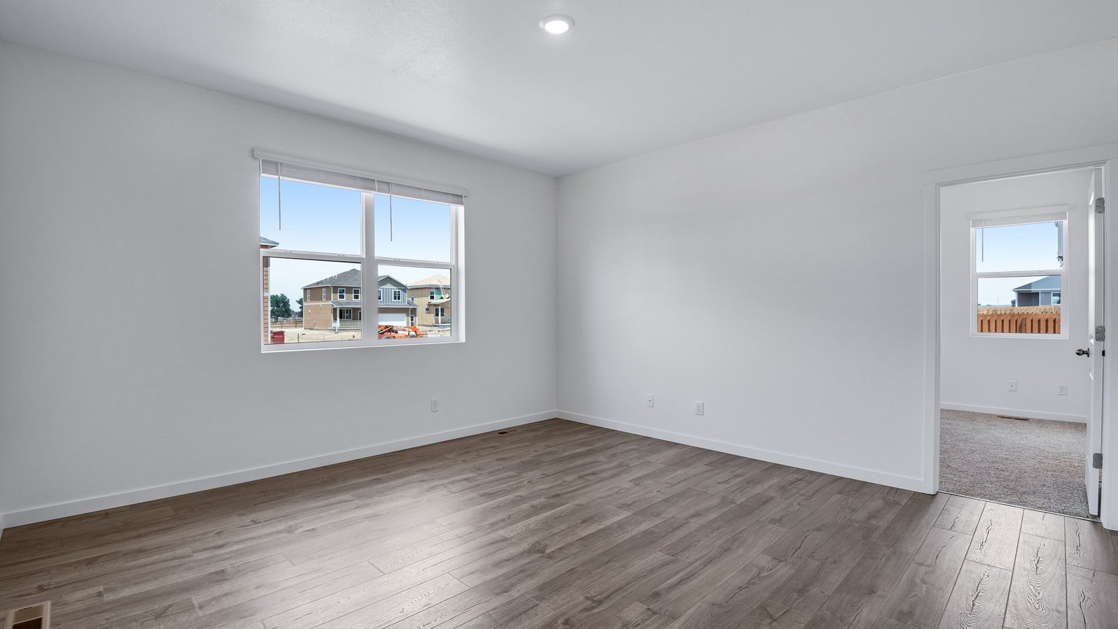 Room with large windows in new D.R. Horton home at Vista Meadows community