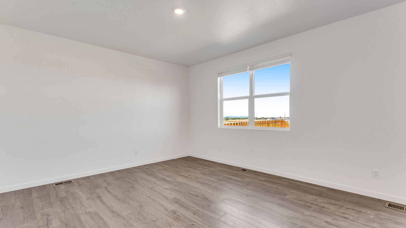 Grand room with large windows in new home at Vista Meadows Community