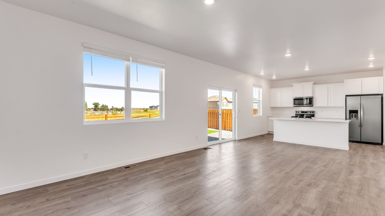 Grand room with large windows in new home at Vista Meadows Community