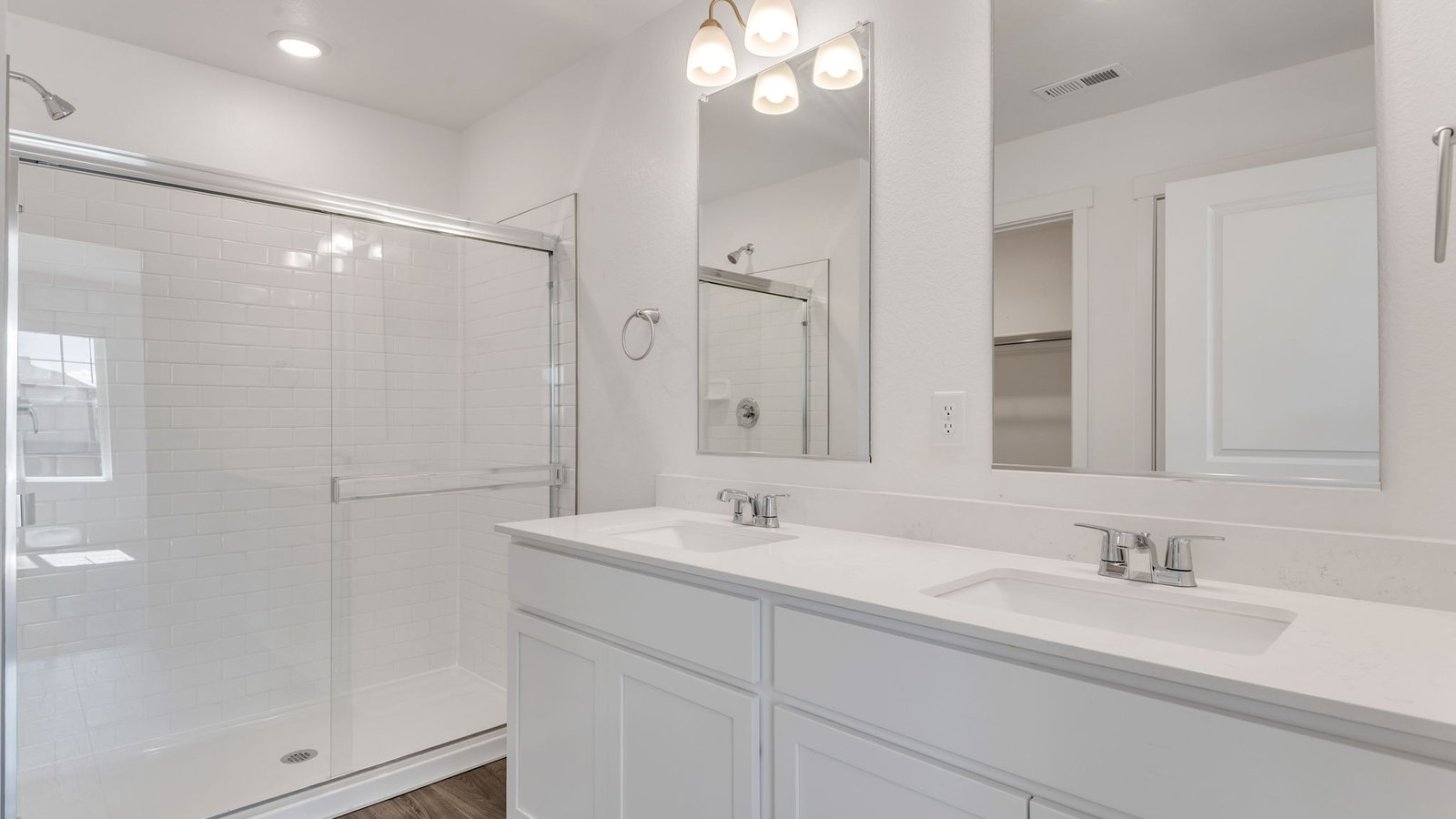 Private attached bathroom with dual vanity sink in new D.R. Horton home in Fort Lupton, Colorado