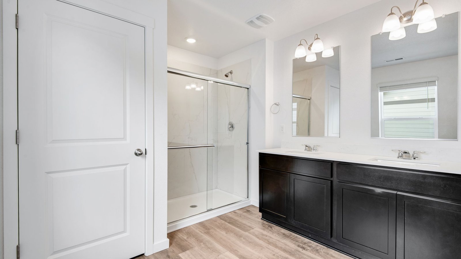 Attached private bathroom in primary bedroom of Pendleton floorplan new home