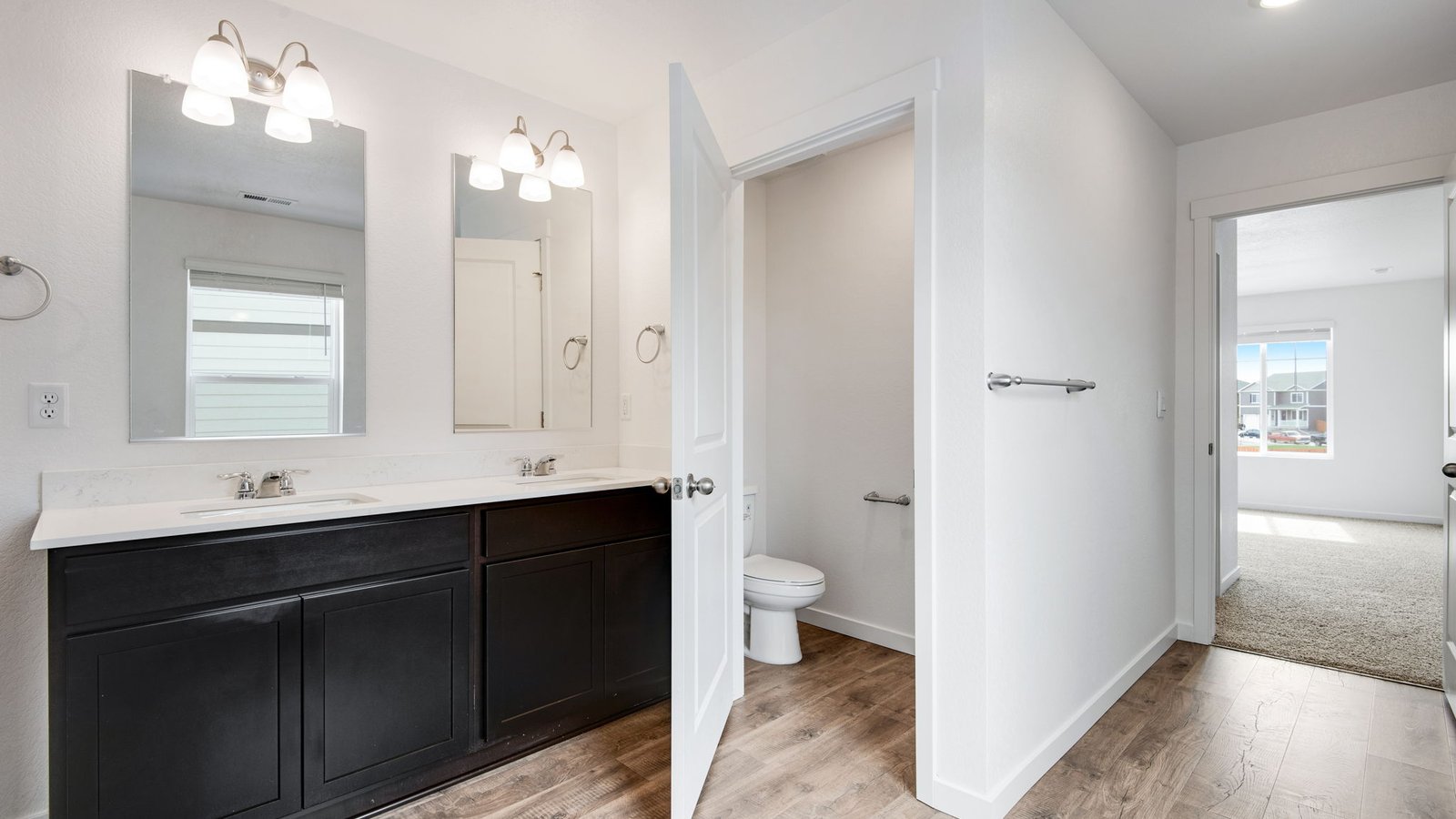 Primary bathroom attached to Primary bedroom in Fort Lupton, CO