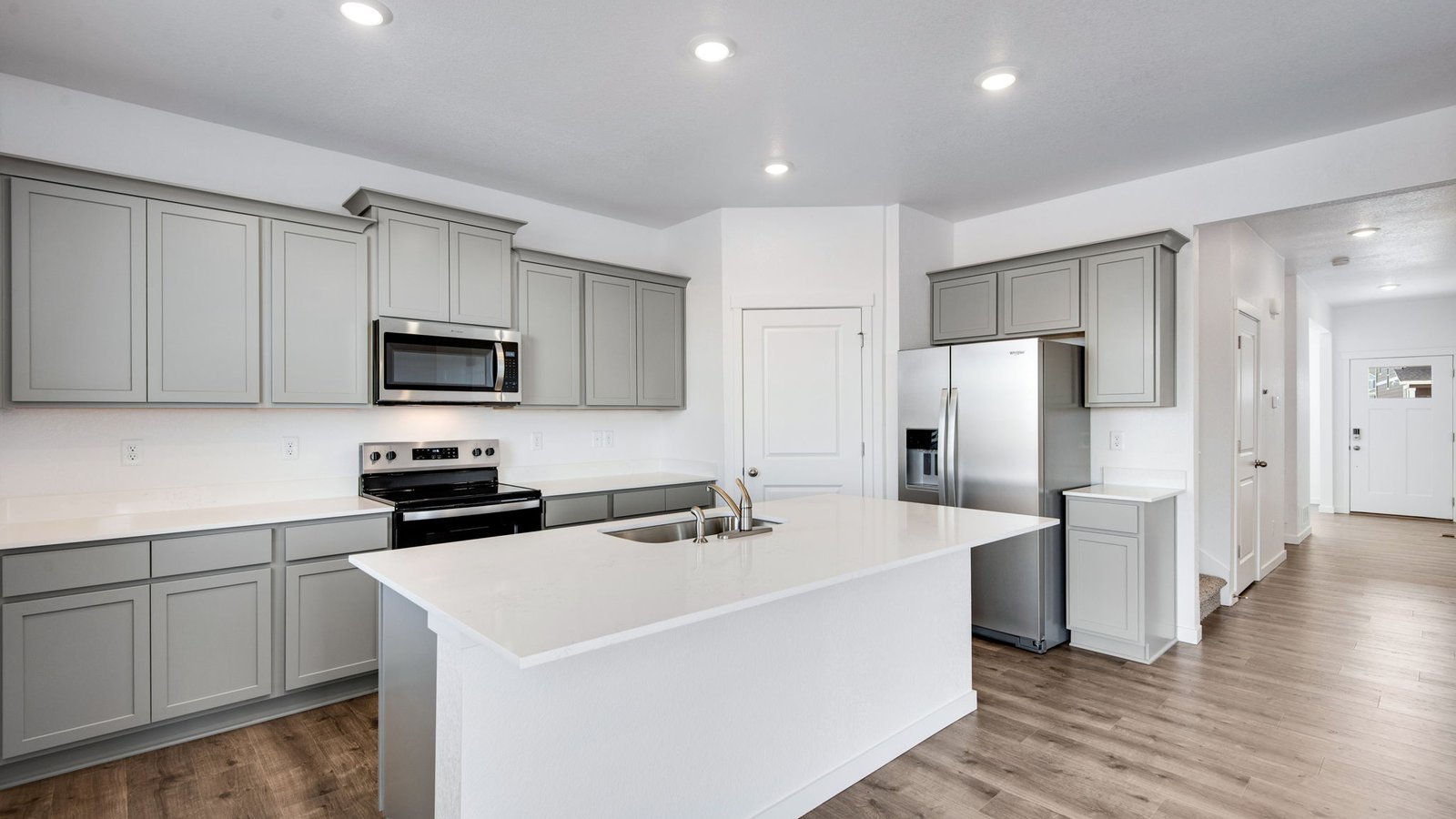 Kitchen with spacious island perfect for entertaining in new D.R. Horton home in Fort Lupton, Colorado