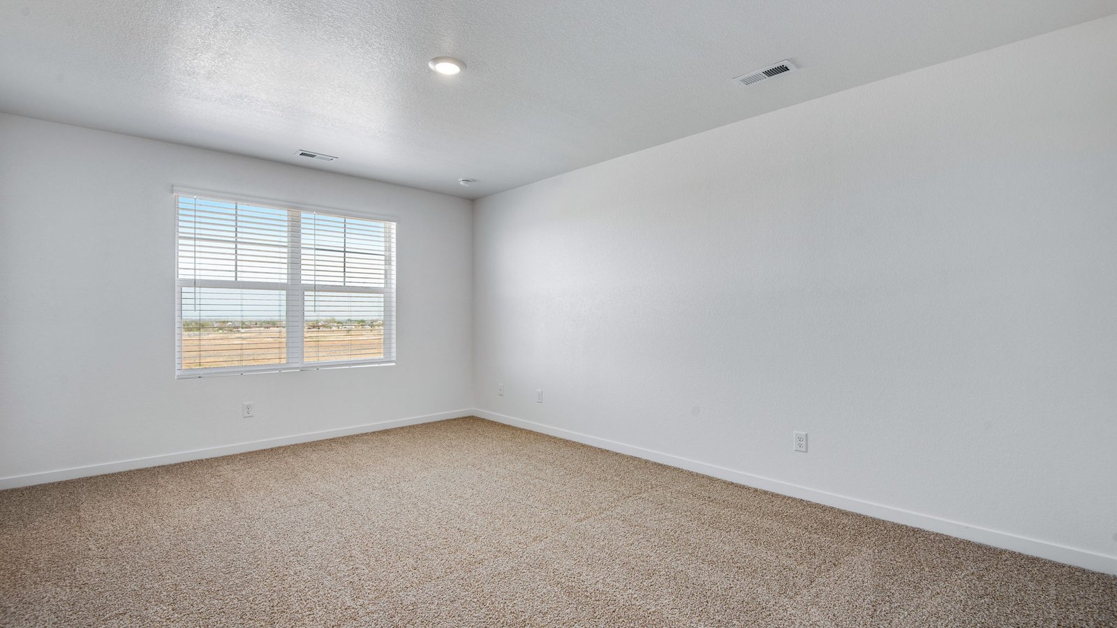 Spacious primary bedroom in new home at Vista Meadows community in Fort Lupton, Colorado
