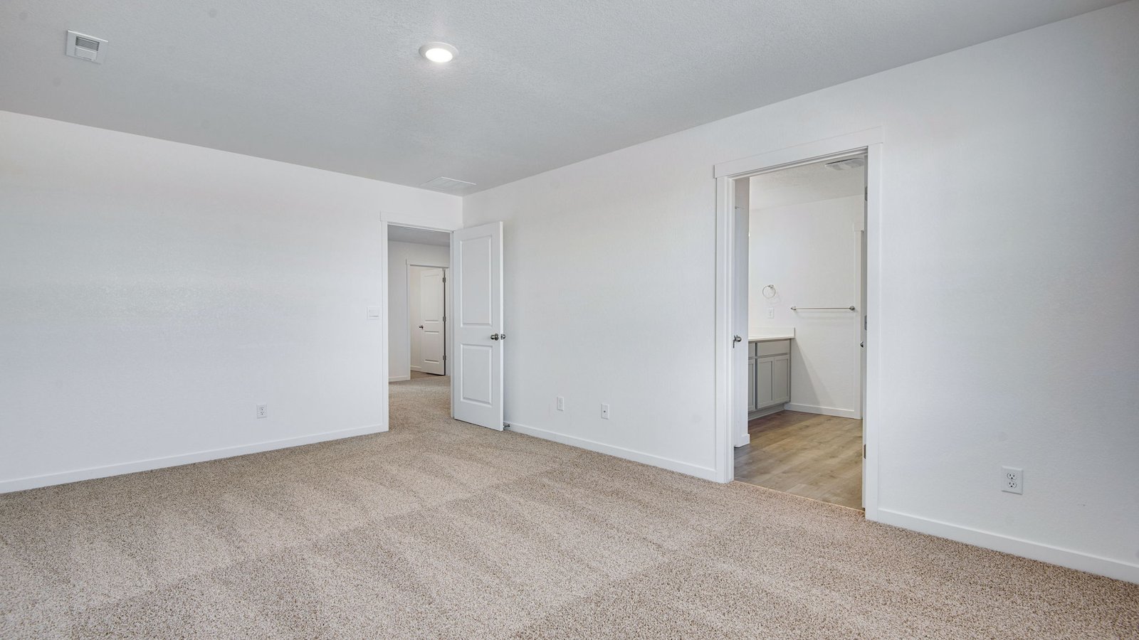 Spacious primary bedroom in new home at Vista Meadows community in Fort Lupton, Colorado