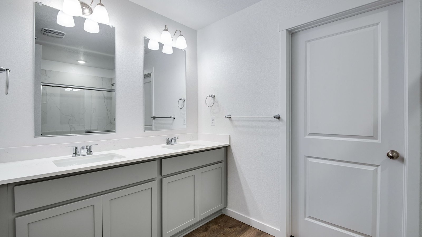 Primary bathroom with dual vanity sinks in new home at Vista Meadows community in Colorado