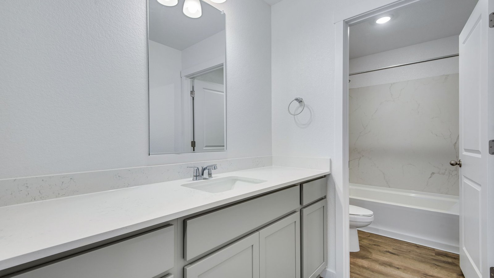 Secondary bathroom with separate bath tub room in new home in Fort Lupton Colorado