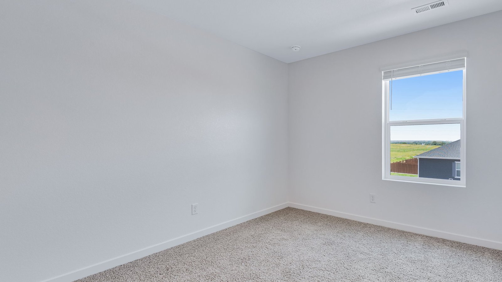 Secondary bedroom with large windows
