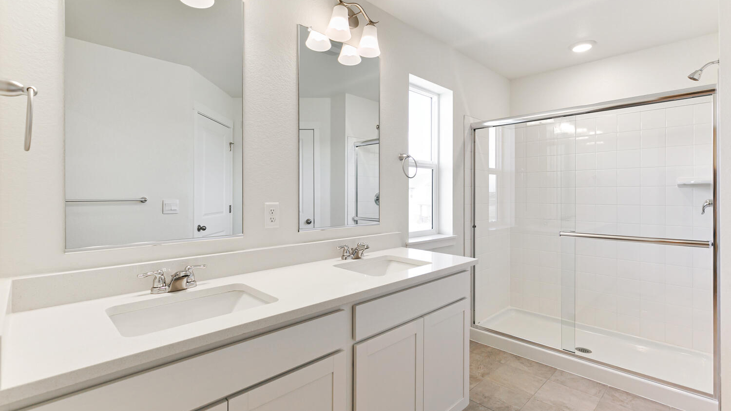 primary bathroom in new home with double sinks