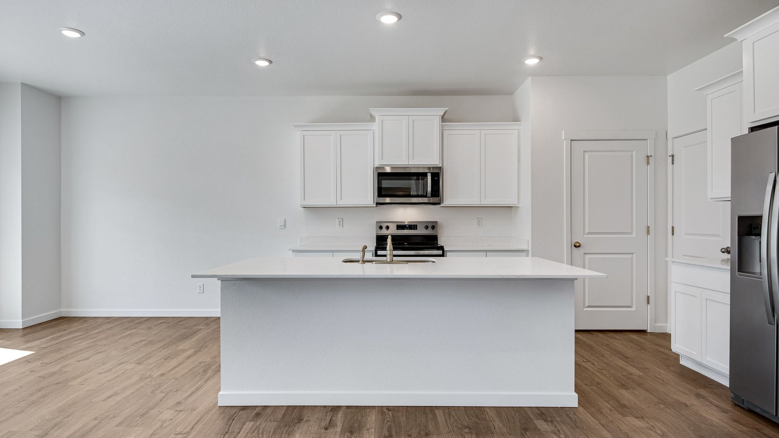 Spacious kitchen with new finishes in new D.R. Horton home at Vista Meadows Community