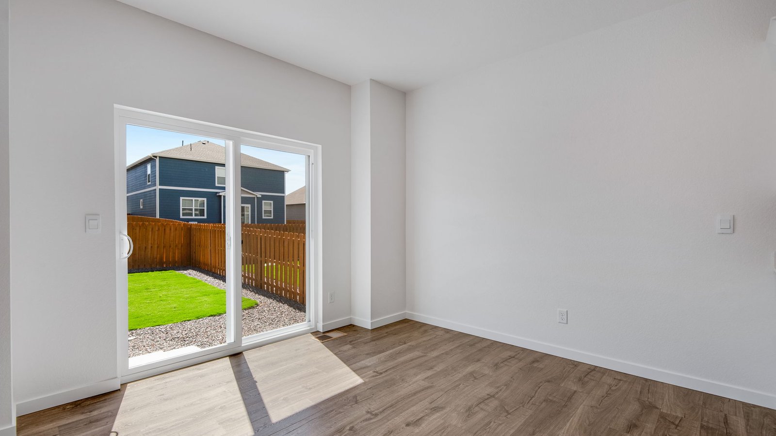 Dining room with access to the backyard in new home community in Fort Lupton Colorado