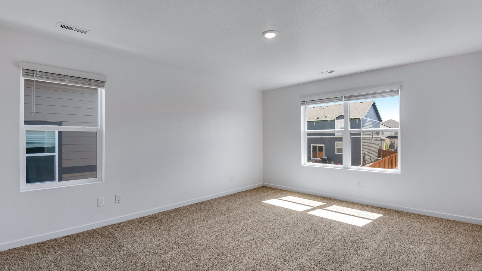 Spacious Primary bedroom with large windows at Vista Meadows Community in Fort Lupton Colorado