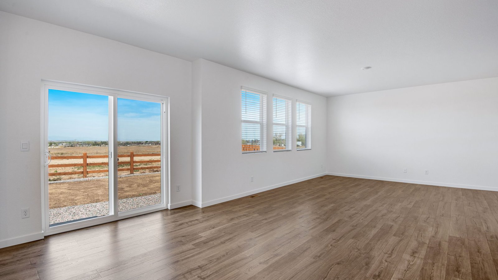 great room and dining room in new construction home by d.R. horton fort lupton, co