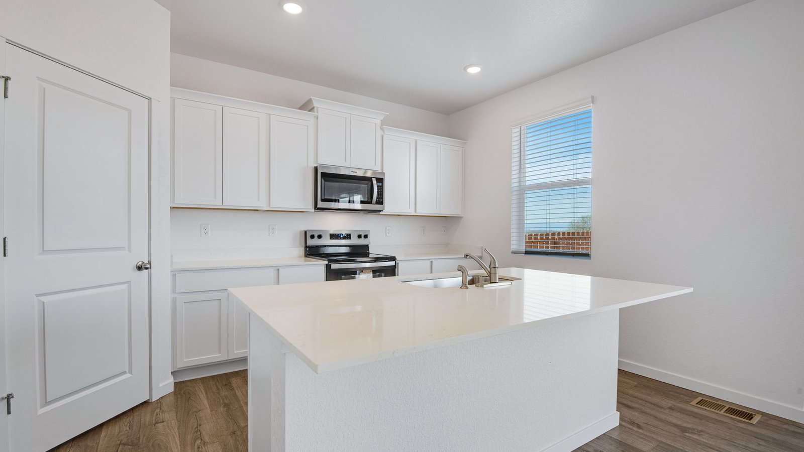 kitchen with pantry in new construction home by d.r. horton