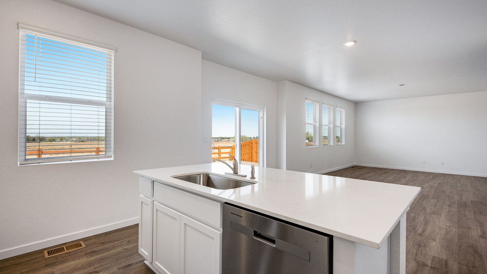 kitchen with large sink and dishwasher in new construction home by d.r. horton fort lupton