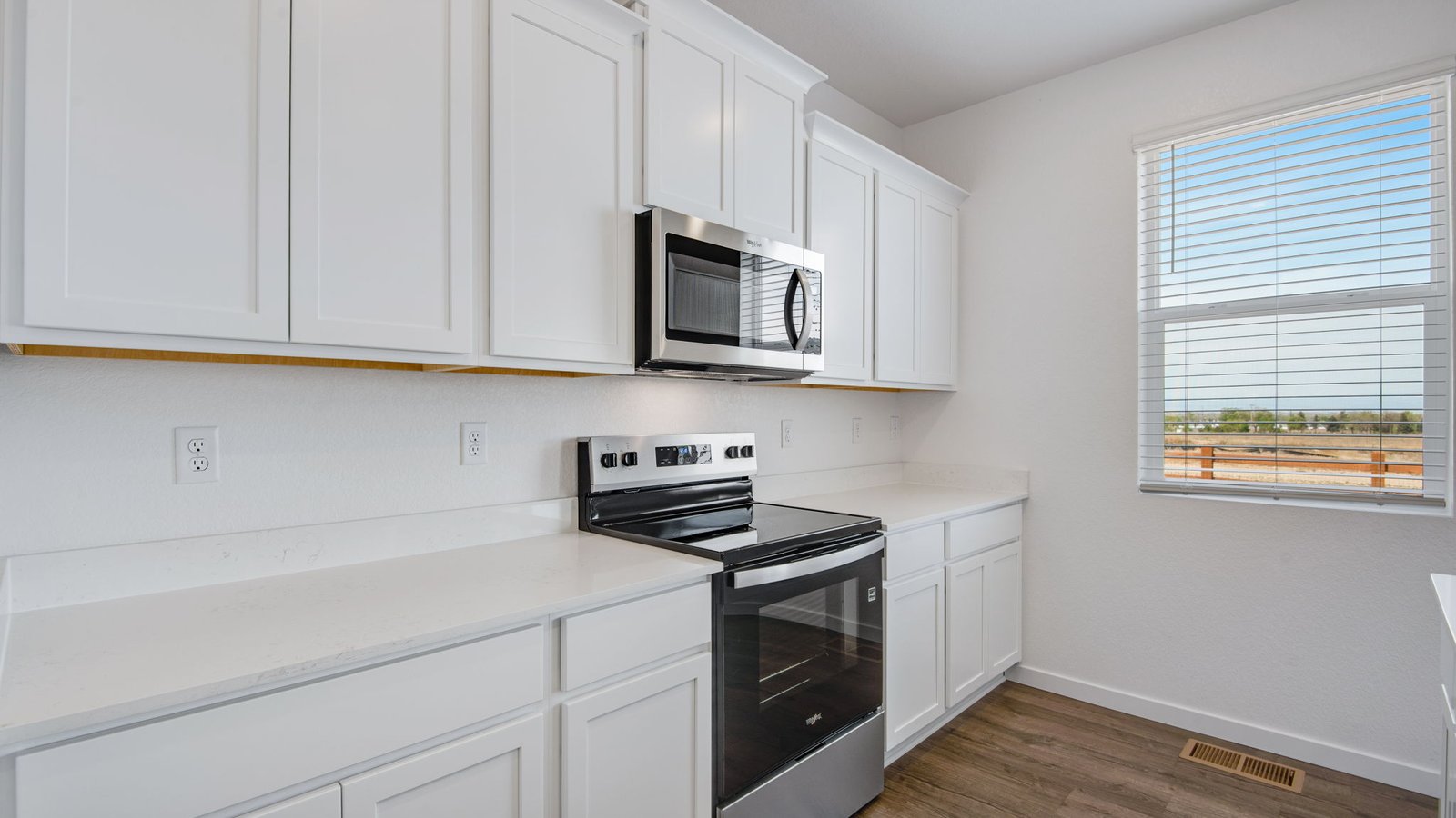 stove and microwave in new home by d.r. horton