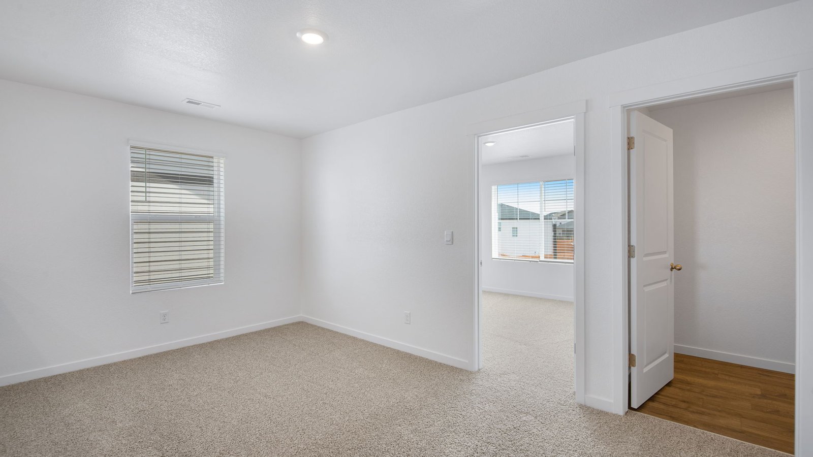 entrance into private primary suite in fort lupton home