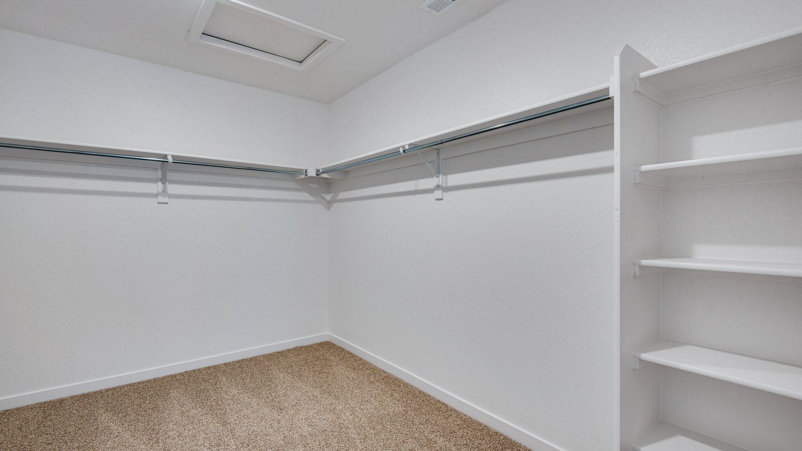 walk-in closet in primary bedroom in new fort lupton home