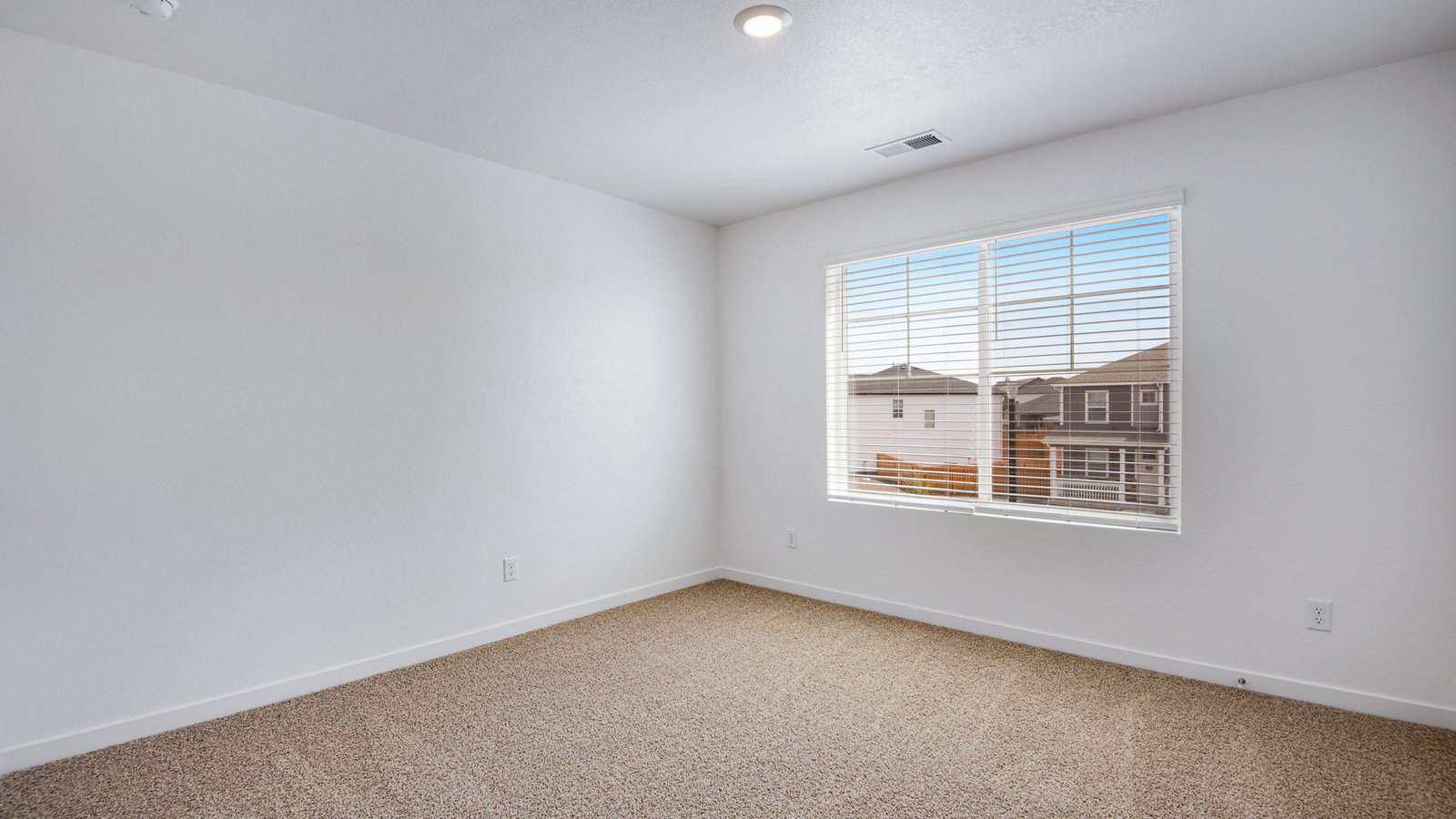 second bedroom with large window in new d.r. horton home
