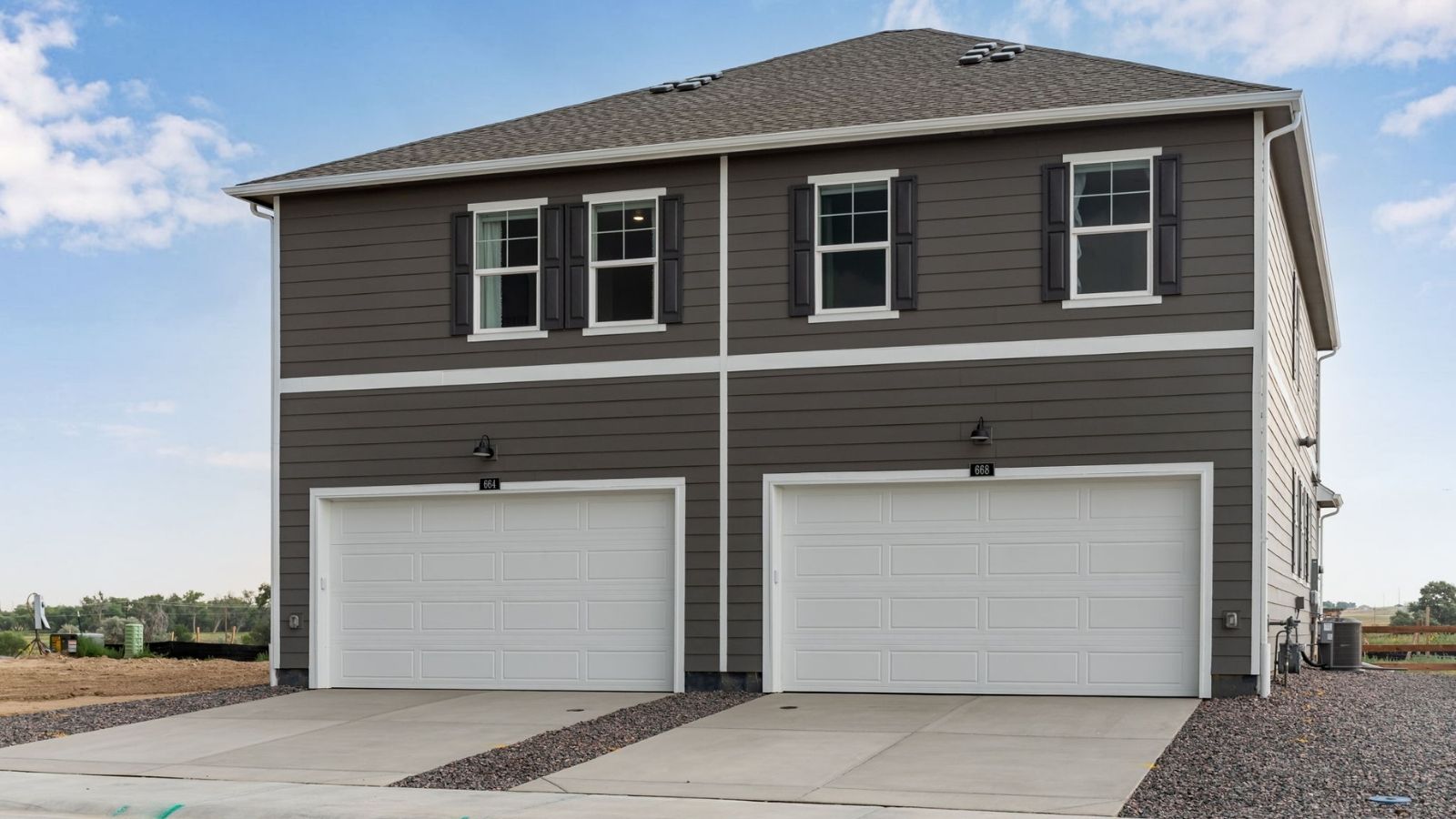 exterior of attached 2 car garage of new d.r. horton home in fort lupton, co