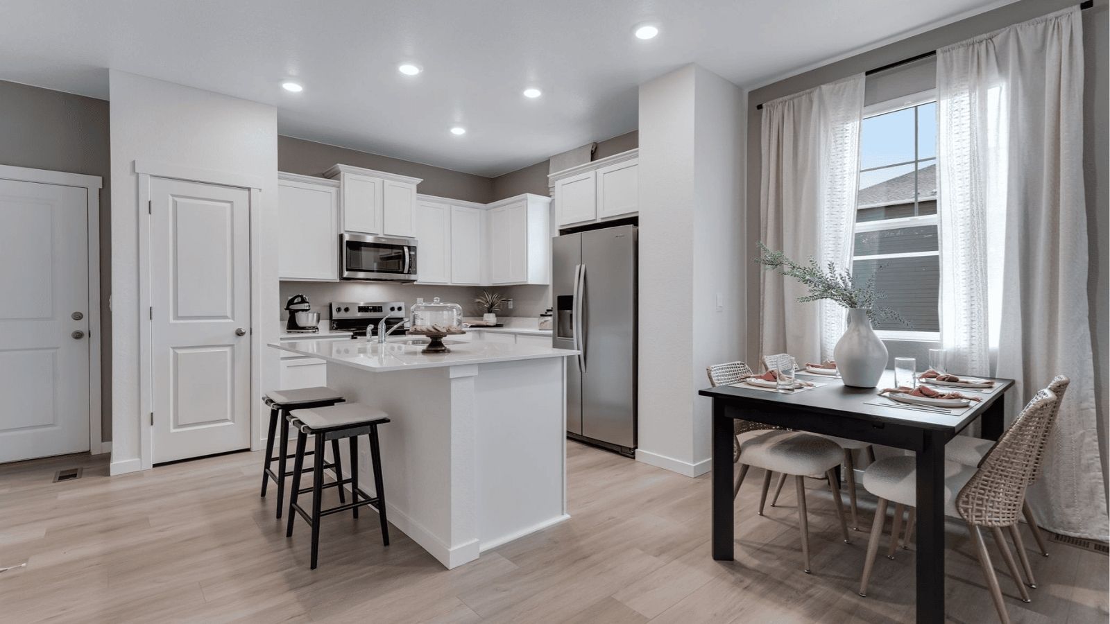 dining room and kitchen in new d.r. horton home in fort lupton, co