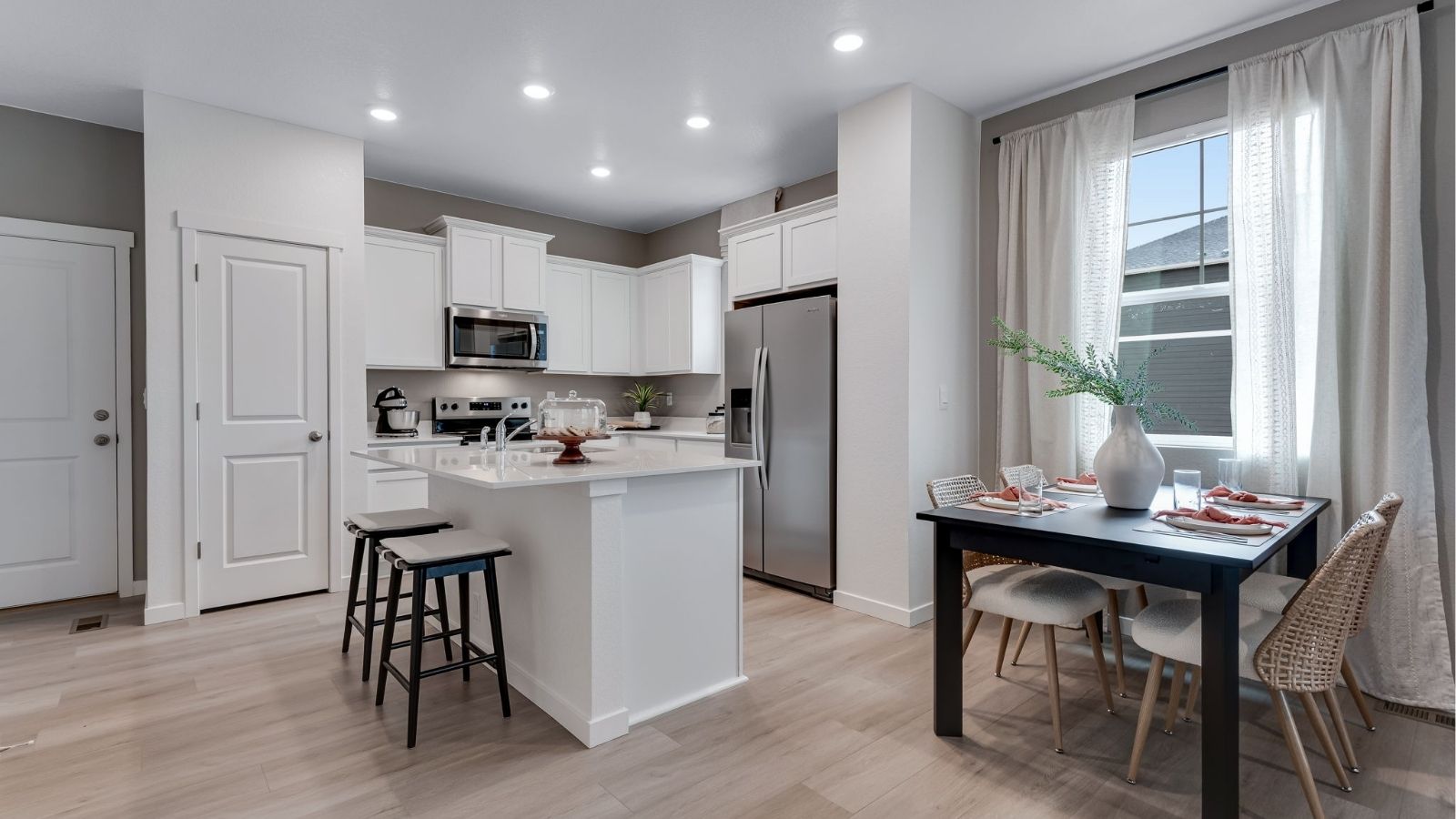 modern kitchen with white cabinets in new construction home fort lupton, co