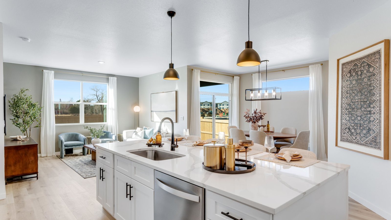 Spacious kitchen island with bar seating and modern finishes in a new Windsor, Colorado home.