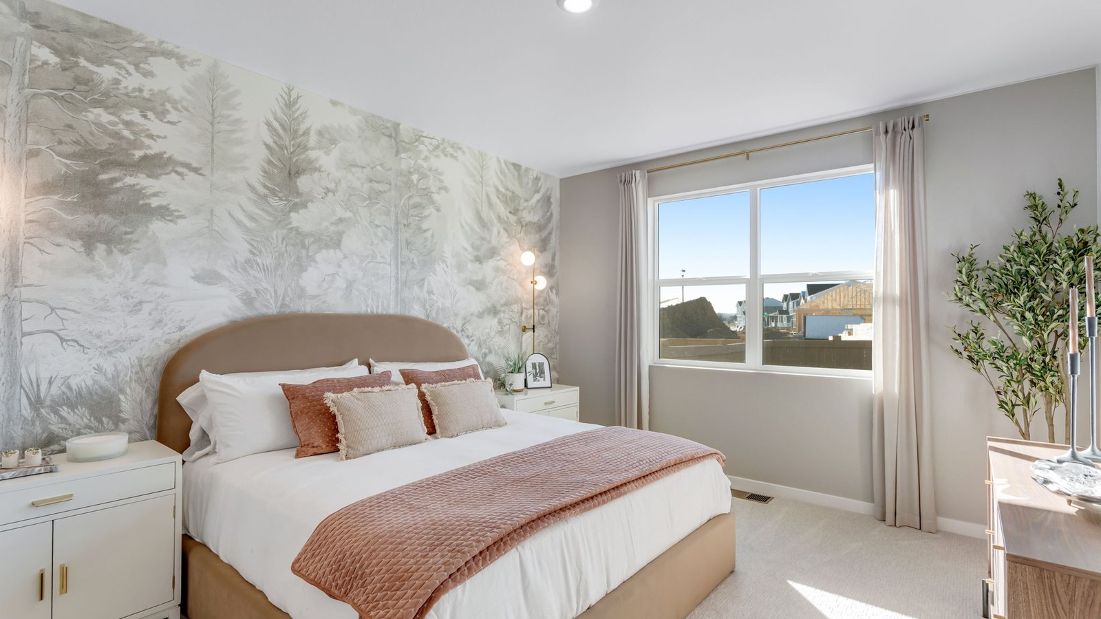 Spacious primary bedroom with large windows and a private retreat feel.