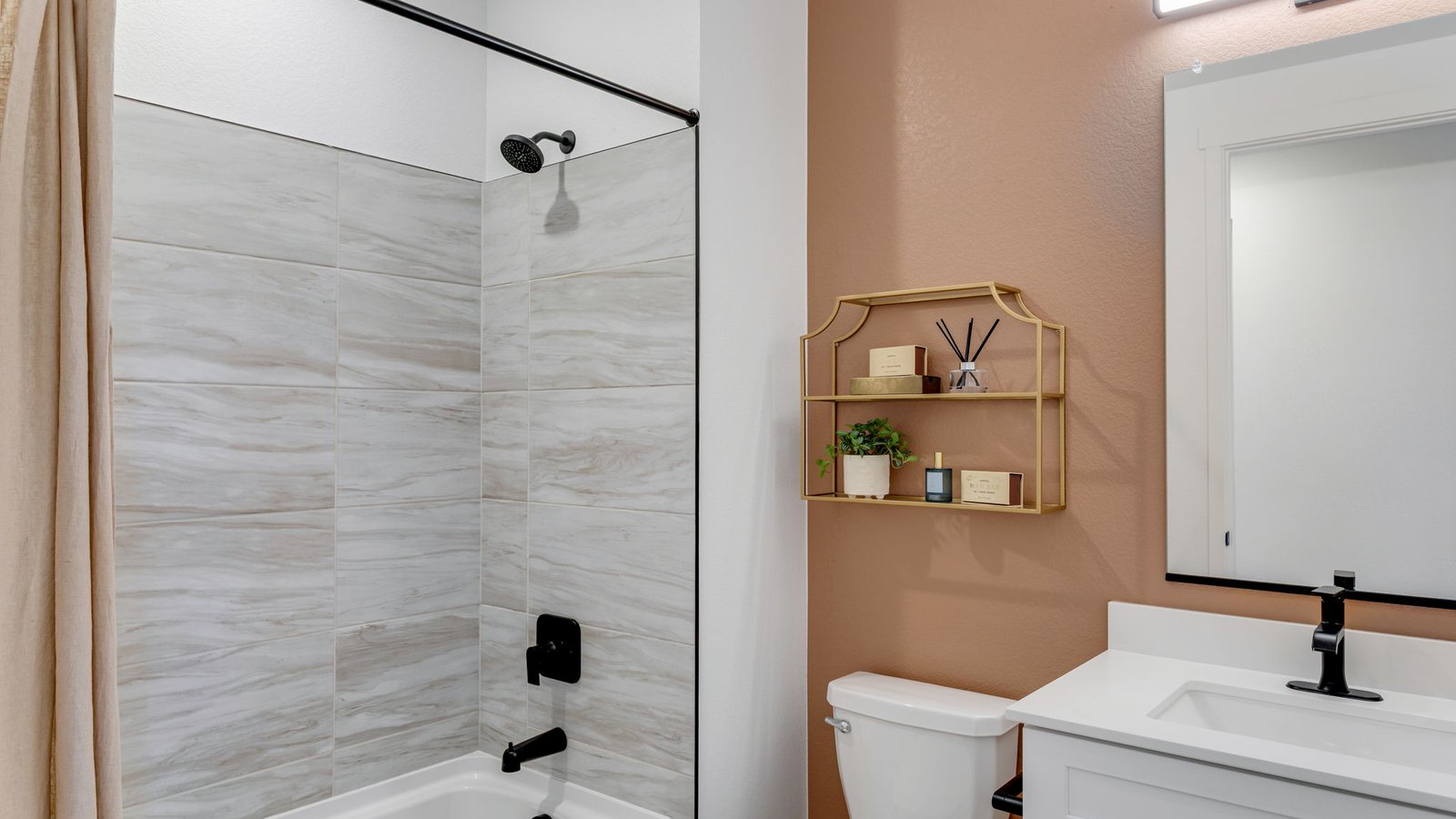 Full bathroom with dual sinks serving the secondary bedrooms.