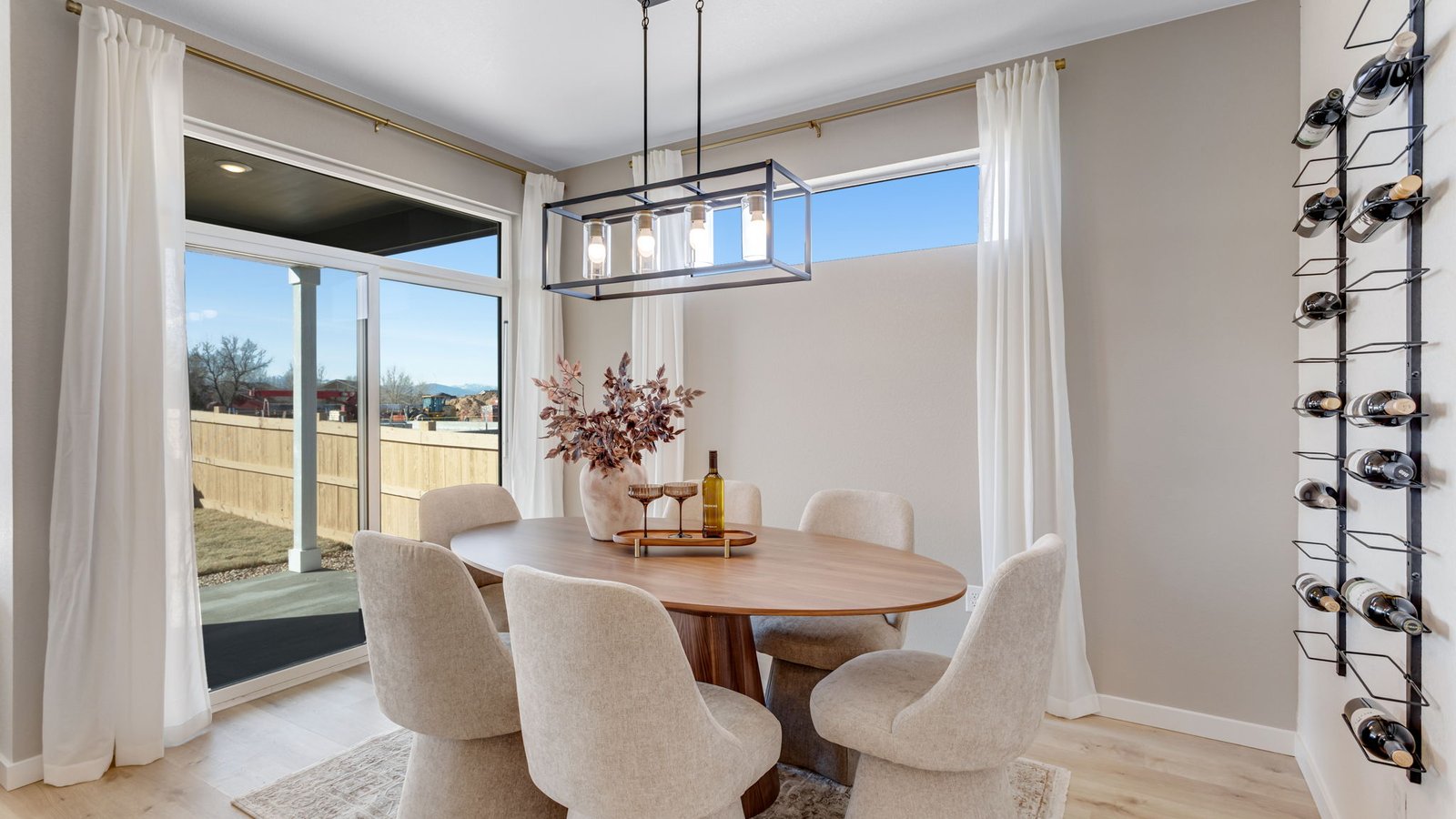 Dedicated dining area adjacent to the kitchen and great room in an open-concept floor plan.