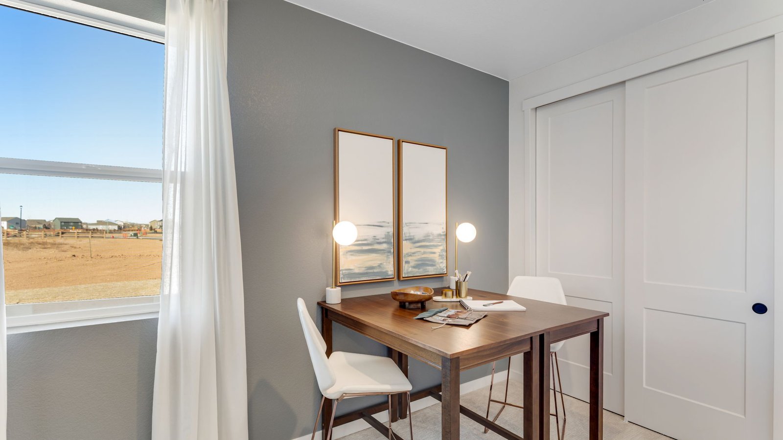 home office with large window in new construction home by d.r. horton