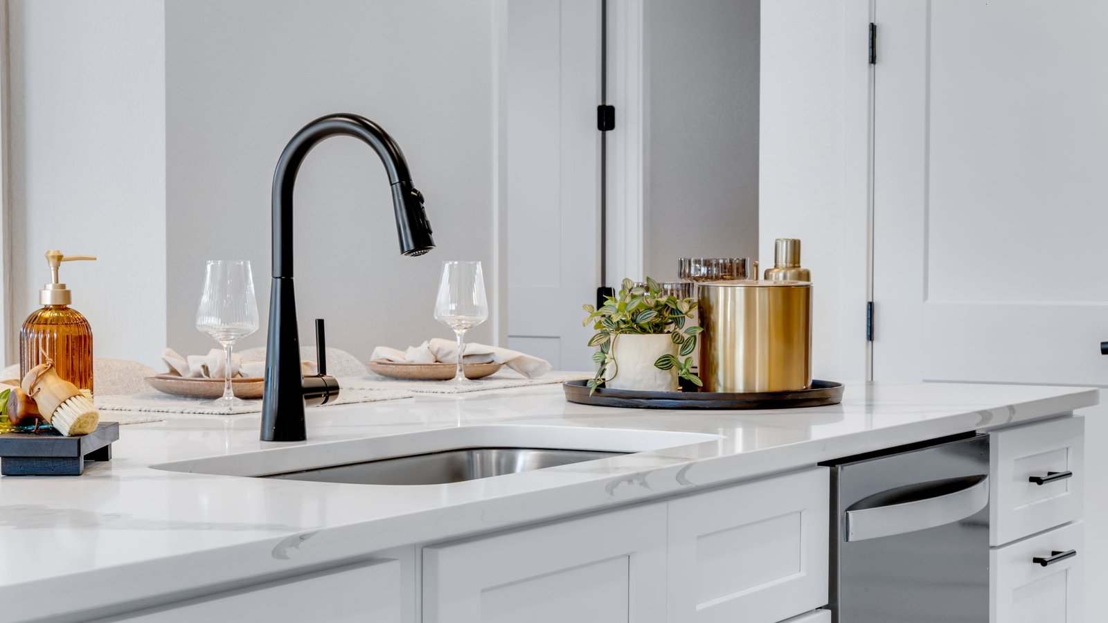 modern black finishes in kitchen of new construction home by d.r. horton